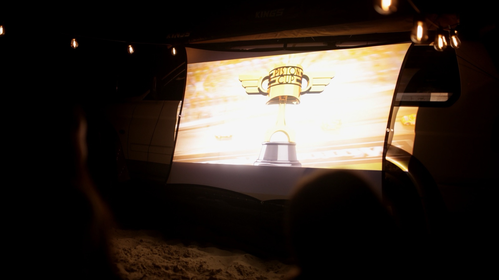 Outdoor cinema under the stars at the Moreton Island campsite