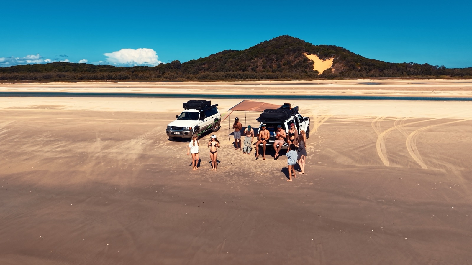 Campfire Crew convoy and travellers on Moreton Island beach
